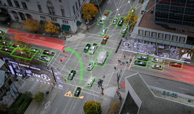 A computer-generated image of downtown streets with cars and overlaid data visuals.