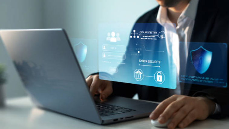 A man at a computer researching cybersecurity solutions.
